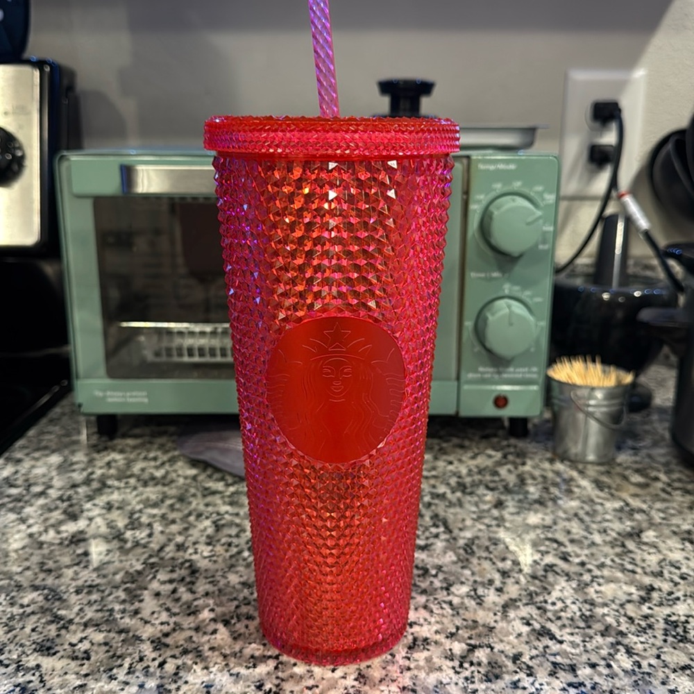 Reddish pink Starbucks cup